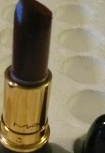 Lipstick, liquid eye liner black, dipbrow,brown